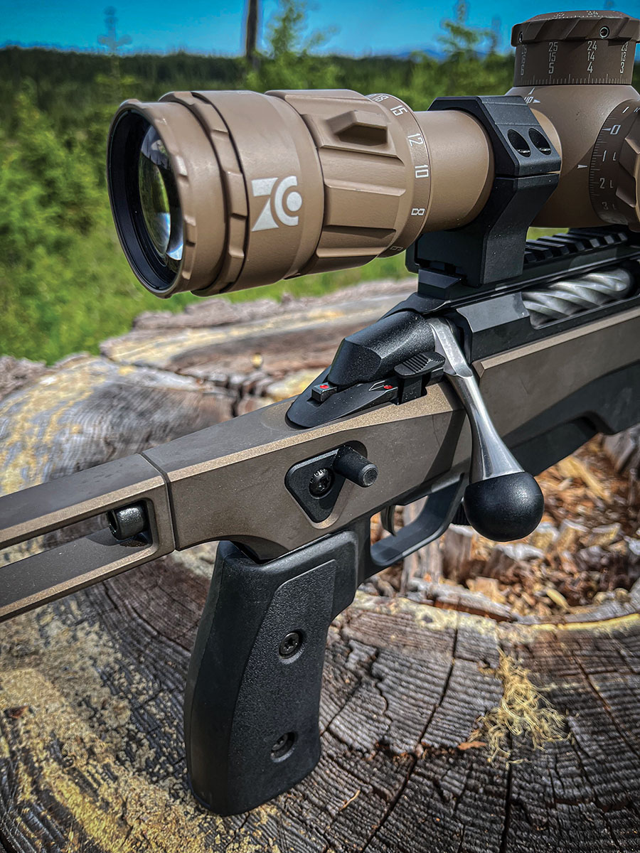 Shown here are the Tikka T3x Ace Game’s two-position safety, bolt shroud cocked indicator tab and side thumb peg, or thumb ledge. The thumb peg can be moved to the right or left side of the rifle as needed.